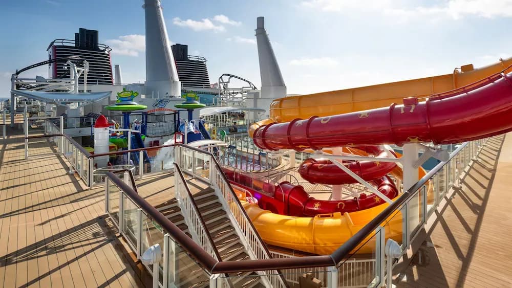Disney characters greeting families aboard a Disney cruise ship