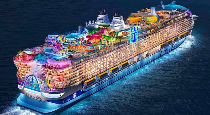 Royal Caribbean ship at sea, wake trailing into a Mediterranean evening