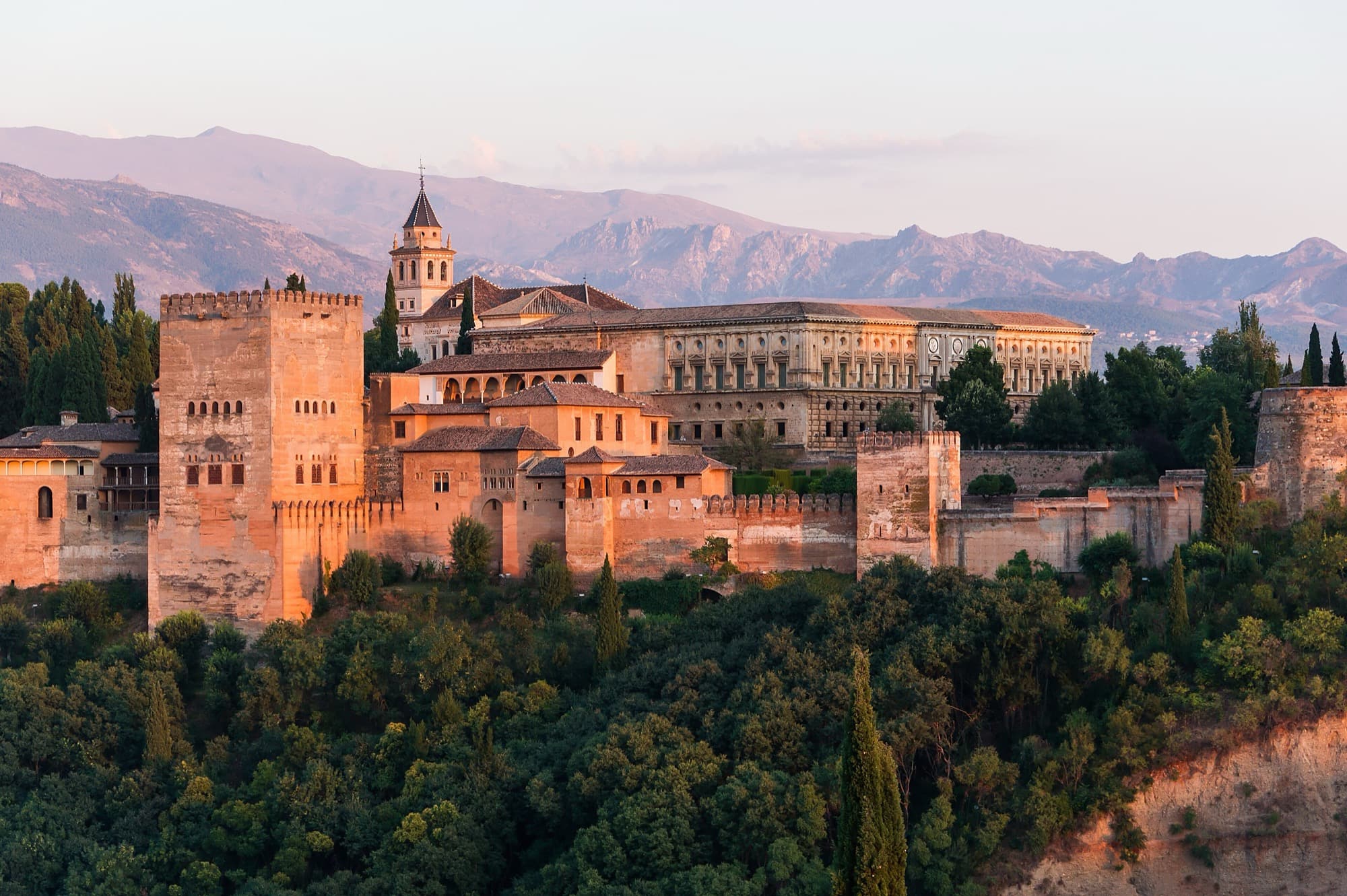 The Alhambra at sunset with the Sierra Nevada behind